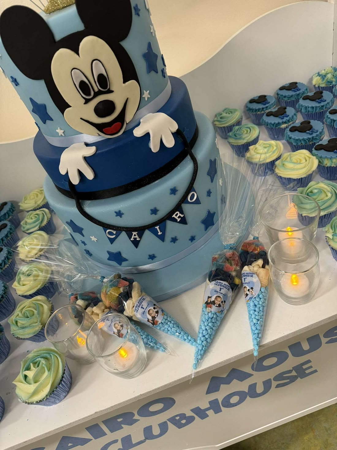 First birthday cake & dessert display with cupcakes and sweets