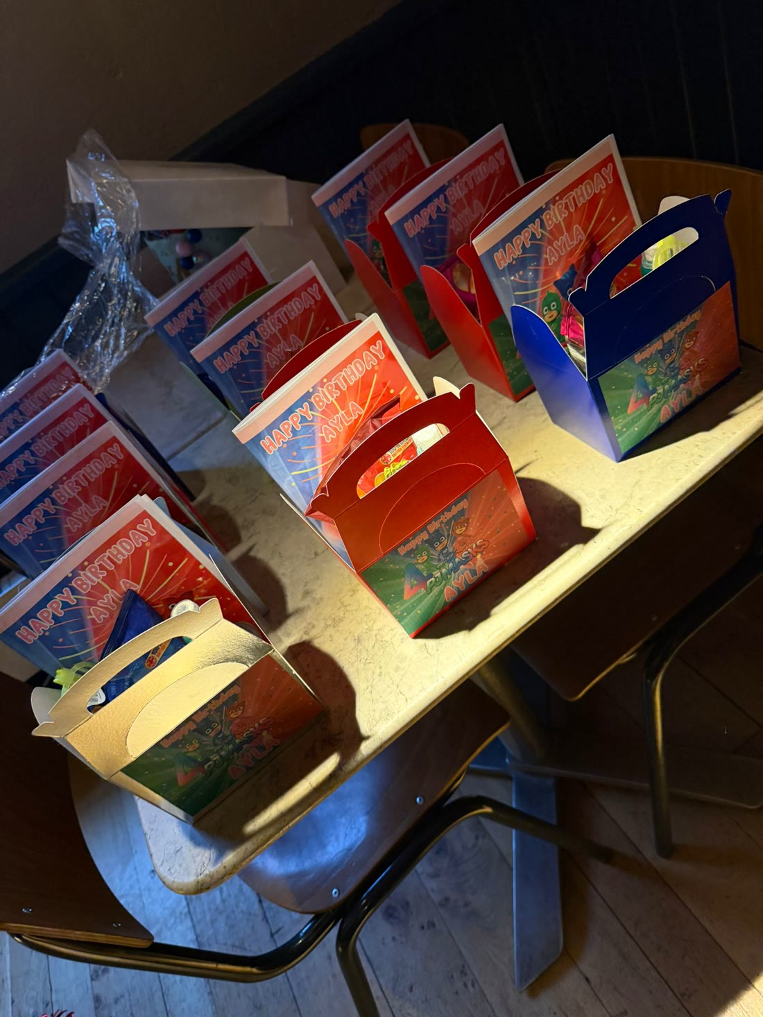 Named favour boxes with matching custom activity books